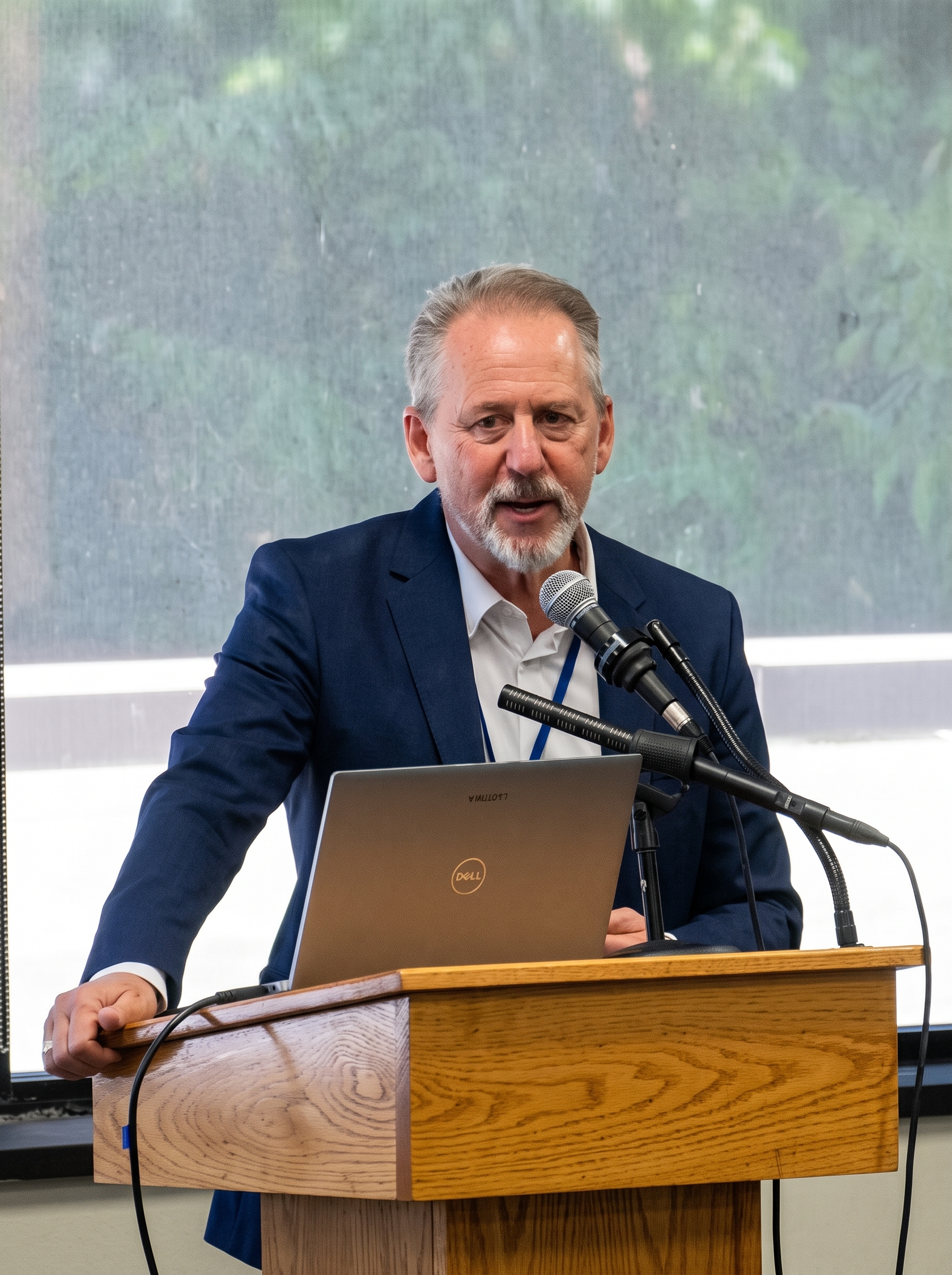 Dr. Joshua Coleman speaking at a podium